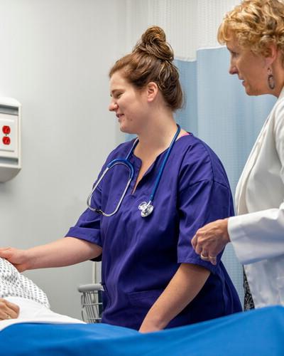 Nurses working with patient 